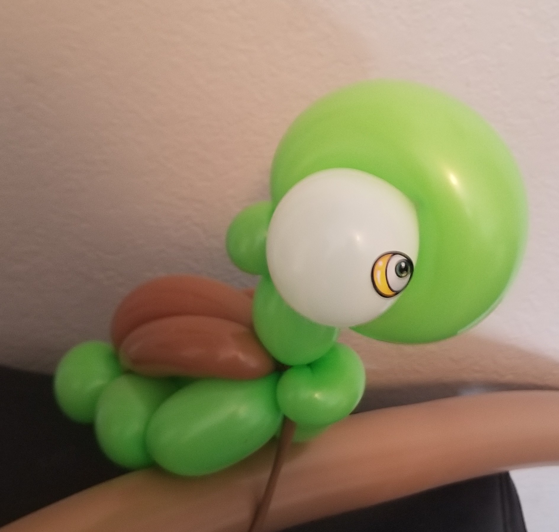 Green one-eyed balloon creature
