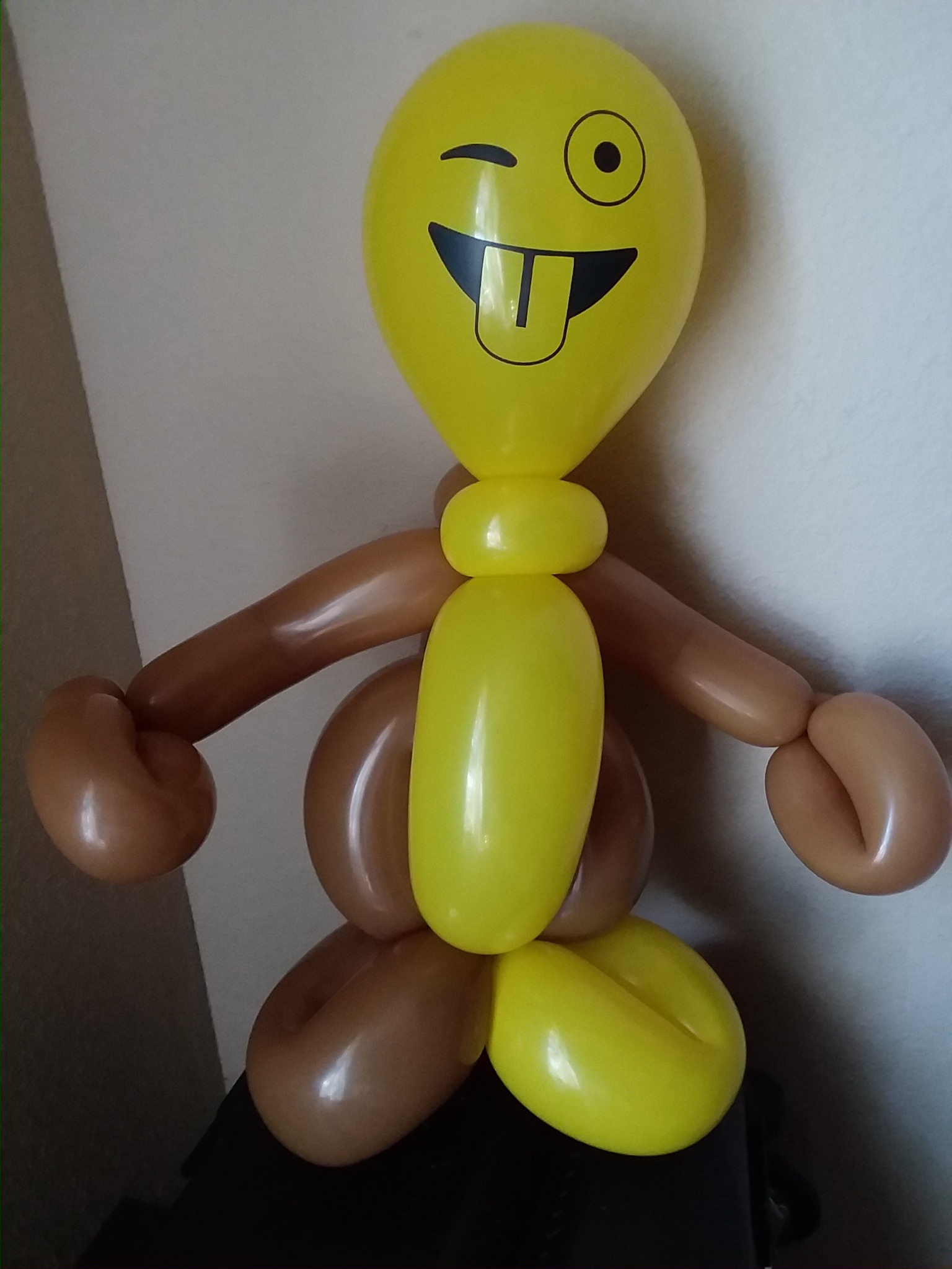 Yellow and brown silly balloon character