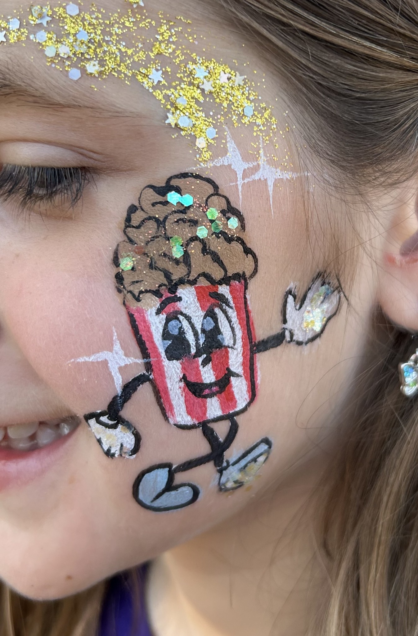 Smiling popcorn character face painting