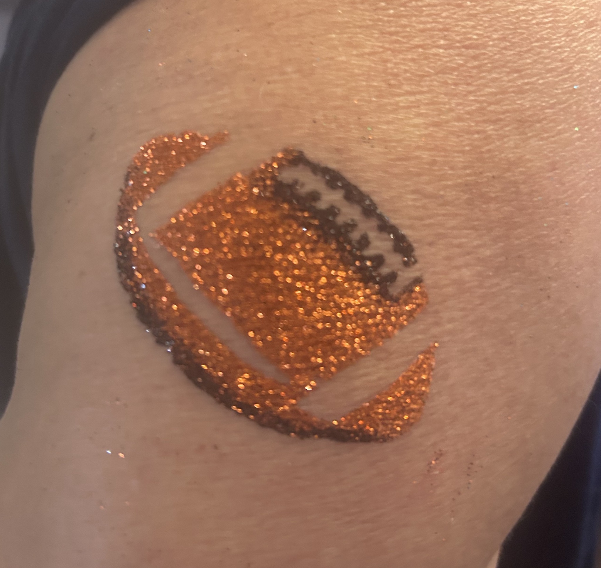 Orange and brown football glitter tattoo